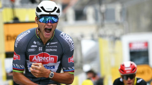 Van der Poel powers into Tour de France lead