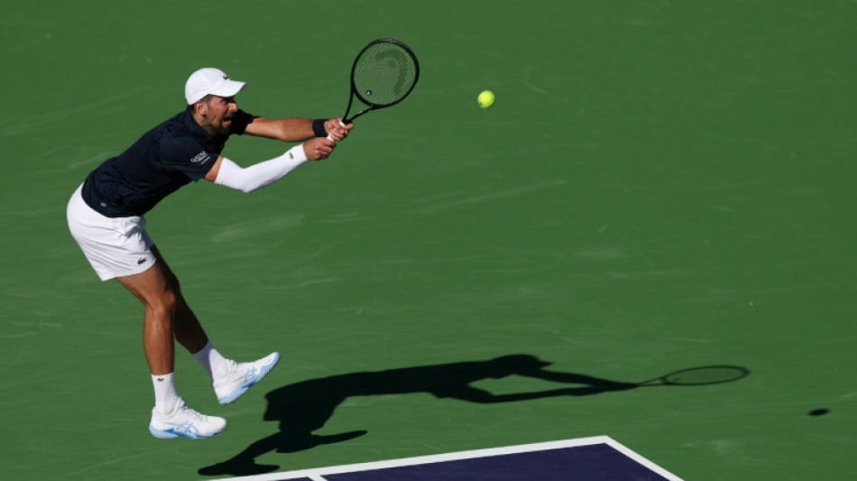 Djokovic battles back to win Indian Wells opener