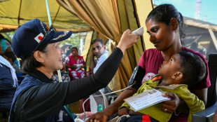 Anguished Sri Lankans queue for care after deadly cyclone