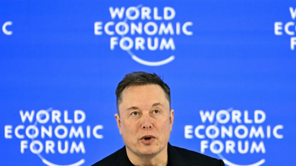 Musk makes Davos debut with promise of robots for all